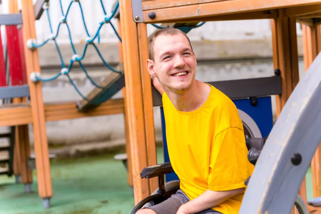 Happy disabled man smiling at camera