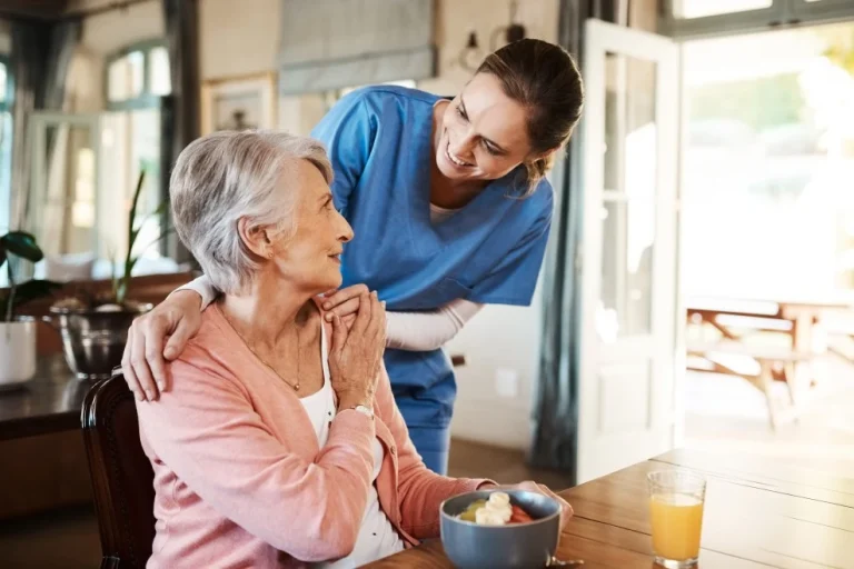 Nurse with elderly woman at home